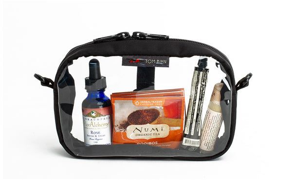 A Black 3D Clear Organizer Cube filled with sundries.